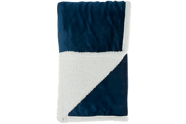 Stay warm and toasty with this fluffy sherpa fleece throw blanket from mina victory home accents. Handmade in a navy blue tone, it reverses to a velvet back for two looks in one. Drape over the corner of your living room couch or at the foot of your bed for an extra-inviting look. This throw is large enough to use as a blanket and stylish enough to use as an accent piece.Handcrafted from 100% polyester | Sherpa fleece | Reverses to poly velvet | Imported