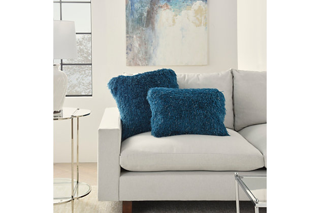 Snuggle up to the comfy, ultra-plush texture of this groovy shag throw pillow from mina victory home accents. With a perfectly simple, fuzzy front and velvety soft back in teal blue, it adds just the right mix of functionality and style. Strips of slender, shimmering yarns add a delicate sheen to its modern design. Includes a cozy polyester insert and zipper closure.Made of 100% polyester | Soft polyfill insert | Plush yarn shag face | Reverses to soft back | Zipper closure | Imported