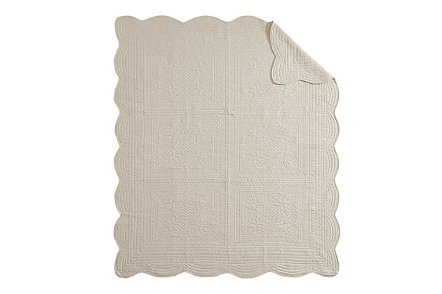 Tuscany is the perfect quilted throw for a new solid look. The decorative stitch pattern pairs easily with your existing decor while the beautiful scalloped edges add a casually elegant element. This oversized throw in a cream shade is filled with soft cotton for extra comfort and features a polyester microfiber fabrication on the front and back. Its prewashed finish gives this decorative throw a worn aesthetic that adds to its cozy appeal. Made of polyester microfiber | Soft cotton fill  | Quilted pattern on face and reverse  | Scalloped edges | Oversized; 60" x 72" | Imported | Machine wash cold, gentle cycle; tumble dry low