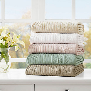Tuscany is the perfect quilted throw for a new solid look. Its decorative stitch pattern pairs easily with your existing decor, while the beautiful scalloped edges add a casually elegant element. This oversized throw in white is filled with soft cotton for extra comfort and features a polyester microfiber fabrication on the front and back. Its prewashed finish gives this decorative throw a worn aesthetic that adds to its cozy appeal.Made with polyester microfiber | Soft cotton fill  | Quilted pattern on face and reverse  | Scalloped edges | Oversized; 60" x 72" | Imported | Machine wash gentle cycle; tumble dry low