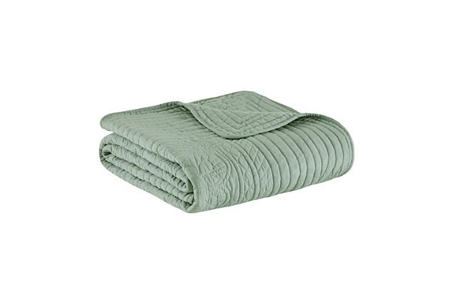 The Madison Park Tuscany Quilted Throw is perfect for a new luxurious look. The decorative stitch pattern pairs easily with your existing decor and adds a stylish element with beautiful scalloped edges. Made from a soft polyester microfiber, this quilted throw in soothing seafoam green is filled with a cotton blend for extra comfort and warmth. Its prewashed finish gives this oversized throw a worn aesthetic for added charm. Made with polyester microfiber | Soft cotton and olefin fill  | Quilted pattern on face and reverse  | Scalloped edges | Oversized; 60" x 72" | Imported | Machine wash gentle cycle; tumble dry low