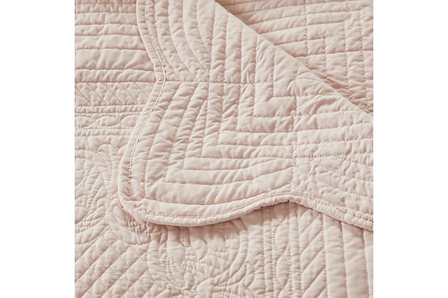 Tuscany is the perfect quilted throw for a new solid look. Its decorative stitch pattern pairs easily with your existing decor, while the beautiful scalloped edges add a casually elegant element. This oversized throw in a beautiful blush shade is filled with a cotton blend for extra comfort and features a polyester microfiber fabrication on the front and back. Its prewashed finish gives this decorative throw a worn aesthetic that adds to its cozy appeal. Made with polyester microfiber | Soft cotton and olefin fill  | Quilted pattern on face and reverse  | Scalloped edges | Oversized; 60" x 72" | Imported | Machine wash gentle cycle; tumble dry low