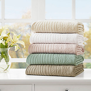 Tuscany is the perfect quilted throw for a new solid look. Its decorative stitch pattern pairs easily with your existing decor, while the beautiful scalloped edges add a casually elegant element. This oversized throw in a beautiful blush shade is filled with a cotton blend for extra comfort and features a polyester microfiber fabrication on the front and back. Its prewashed finish gives this decorative throw a worn aesthetic that adds to its cozy appeal. Made with polyester microfiber | Soft cotton and olefin fill  | Quilted pattern on face and reverse  | Scalloped edges | Oversized; 60" x 72" | Imported | Machine wash gentle cycle; tumble dry low