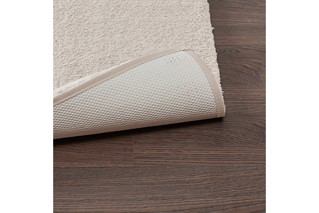 Experience the true feeling of luxurious comfort with the Madison Park Signature Marshmallow bath rug. This spa-quality bath rug is made of resilient high pile tufted microfiber for an incredibly plush feel, while also featuring a quick-dry technology that keeps your rug feeling soft and dry each time you step onto it.Made of polyester | 0.75" pile | Oeko-Tex Certified, includes no harmful substances or chemicals | Non-skid latex backing  | Machine washable | Imported