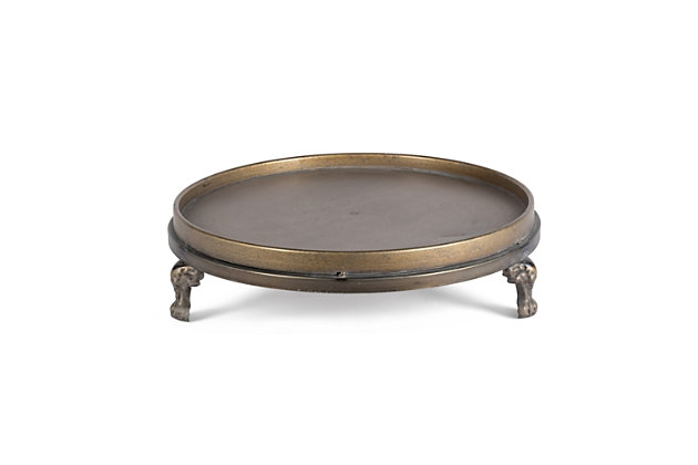 You'll add a touch of simple elegance to your home with this charming set of two decorative footed trays. Each of these delightful trays has a burnished goldtone finish. Arranged separately or together, they're the perfect housewarming gift for that special someone, or can be used to enhance and accentuate your personal decor.Set of 2 | Made of iron with goldtone finish | Stack trays and decorate with faux greenery, LED candles and stones or river rocks (not included) | Raised edges | 3 beautiful ornate legs on each tray
