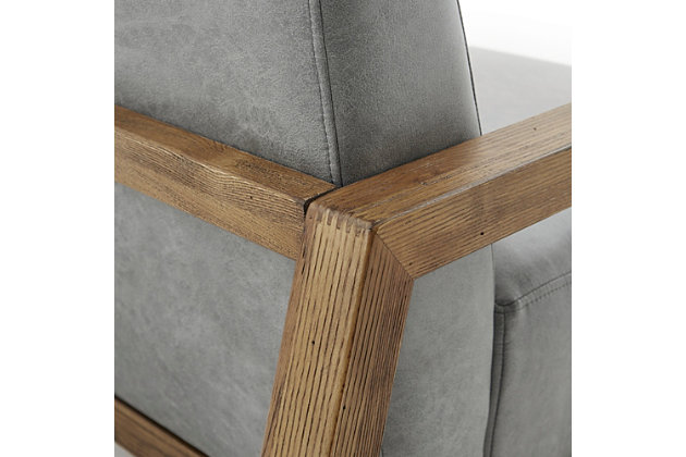 Add a sophisticated update to your living room with the INK+IVY Easton Accent Chair. Upholstered in gray faux leather, the chair features a reclaimed oak wood finish for a contemporary look. Sit in luxurious comfort and bring an elevated touch to your home decor.Made with wood | Reclaimed oak finish | Polyester upholstery | Foam and silk wadding fill | Assembly required