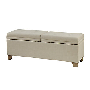 Bring style and functionality to your home with the Madison Park Ashcroft Storage Bench. Upholstered in a natural-hued fabric, it features a split button-tufted top that lifts to reveal an ample space for your blankets. The solid wood legs complement the upholstery with a natural finish. Simple and versatile, this upholstered storage bench pairs easily with most home decor.Made with wood | Polyester upholstery | Foam filling | Button tufting | Top split in half | Storage space under lift top