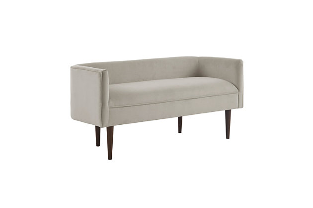The Madison Park Farrah Accent Bench offers a fashionably unique update to your living room or entryway. This accent bench is upholstered in a rich cream-colored velvet fabric and features a low back and sides for a chic, transitional look. Solid wood legs flaunt a dark brown finish that adds a bold contrast to the upholstery.Made with wood | Legs with dark brown finish | Polyester upholstery | Foam filling | Assembly required