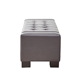 Covered in decadent faux leather upholstery, the handsome button-tufted design of the Mirage Storage Bench is a must-have. The top lifts to reveal extra storage space, making this classy accent both fashionable and functional. Made with wood | Polyester upholstery | Foam filling | Storage space under lift top | Tufted detailing