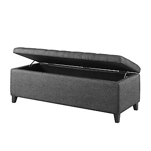 The modern Shandra Storage Bench both organizes linens and impresses with its stylish details. Featuring an elegant gray textured fabric with rich black legs, it provides the perfect functional finishing touch for your space. Made with wood | Legs with black finish | Polyester upholstery | High-density foam filling | Button-tufted detailing | Interior storage