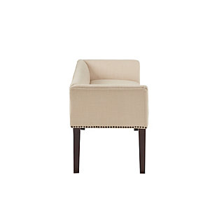 Accent your home with the simple elegance of the Madison Park Welburn Accent Bench. Upholstered in a cream-hued fabric, it features a low back and flared arms that create a sleek and sophisticated look. Bronze-tone nailhead trim adds elegance, while the wood finish complements its upholstery. Perfect for your bedroom or living room, this upholstered bench provides a chic update to your home decor. Made with wood | Legs with Morocco finish | Polyester/linen upholstery | Foam filling | Bronze-tone nailhead trim | Low back and arms