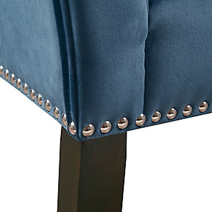 Accent your home with the simple elegance of the Madison Park Welburn Accent Bench. Upholstered in a blue fabric, it features a low back and flared arms that create a sleek and sophisticated look. Bronze-tone nailhead trim adds elegance, while the wood finish complements its upholstery. Perfect for your bedroom or living room, this upholstered bench provides a chic update to your home decor. Made with wood | Legs with dark coffee-colored finish | Polyester upholstery | Foam filling | Bronze-tone nailhead trim