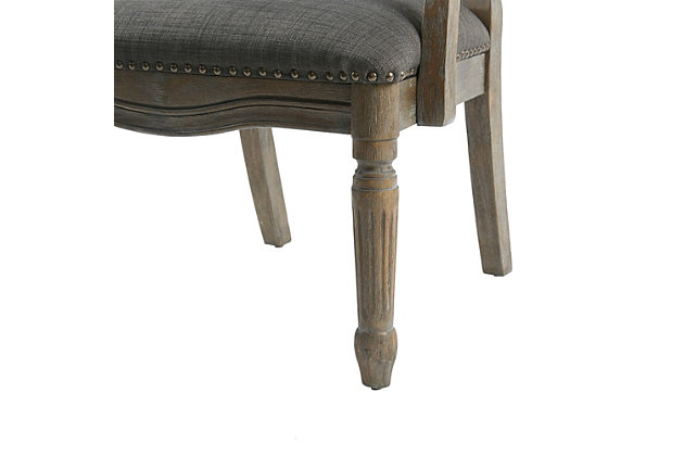 Discover sophistication in the Brentwood Armchair, a modernized update to a classic traditional design. The wonderful mix of a graphite fabric combined with a reclaimed gray finish and nailhead trim gives this chair definite modern appeal. Made with wood | Reclaimed gray finish | Polyester upholstery | High-density foam filling | Hand-carved frame | Bronze-tone nailhead trim | Assembly required