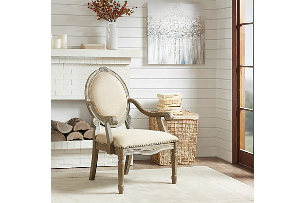 Discover sophistication in the Brentwood Armchair, a modernized update to a classic traditional design. The wonderful mix of a linen-look fabric combined with a reclaimed natural finish and nailhead trim gives this chair definite modern appeal. Made with wood | Reclaimed natural finish | Polyester upholstery | High-density foam filling | Hand-carved frame | Bronze-tone nailhead trim | Assembly required