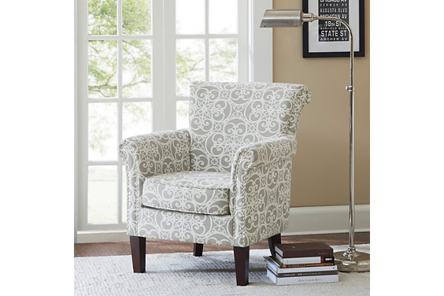 Add an eye-catching touch to your living room with the Madison Park Brooke Tight Back Club Chair. This accent chair features an all-over fretwork pattern on gray-hued upholstery, creating a stunning transitional look. Silvertone nailhead trim on the front of the arms and the sides of the back adds an elegant accent to the design. With a comfortable loose cushion and sturdy solid wood legs, this club chair brings a chic style to your home decor.Made with wood | Legs with black finish | Polyester upholstery | High-density foam filling | Double rows of silvertone nailhead trim on arm and side | Round arms | Tight back, loose seat | Assembly required