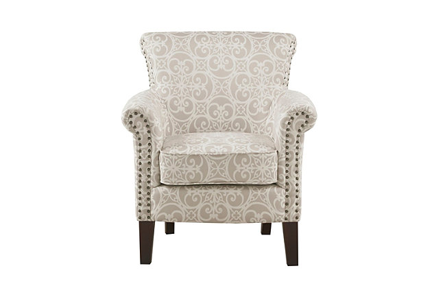 Add an eye-catching touch to your living room with the Madison Park Brooke Tight Back Club Chair. This accent chair features an all-over fretwork pattern on natural-hued upholstery, creating a stunning transitional look. Bronze-tone nailhead trim on the front of the arms and the sides of the back adds an elegant accent to the design. With a comfortable loose cushion and sturdy solid wood legs, this club chair brings a chic style to your home decor.Made with wood | Legs with espresso-hued finish | Rayon/polyester upholstery | Foam filling | Double rows of bronze-tone nailhead trim on arm and side | Round arms | Tight back, loose seat | Assembly required