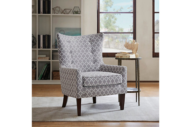 The Carissa Shelter Wing Chair's reinterpretation of the wingback is a refined new classic. Sheltering wings create narrow arms with subtle tufting accents, while the gray fretwork upholstery gives this chair added appeal.Made with wood | Legs with black finish | Polyester upholstery | High-density foam filling | Tight back, loose seat | Button tufting | Assembly required