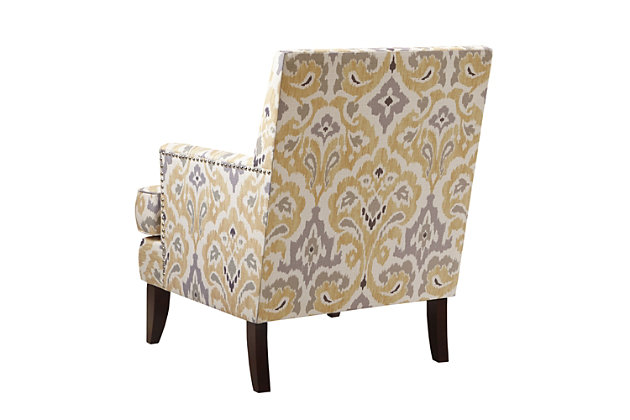 The track arm Colton Club Chair is sure to impress with its sleek contemporary lines, exposed wood legs and nailhead trim. It provides a charming new spin on the classic living room, making it a must-have for modern homemakers.Made with wood | Legs with espresso-hued finish | Polyester upholstery | High-density foam filling | Silvertone nailhead trim | Tight back, loose seat | Assembly required