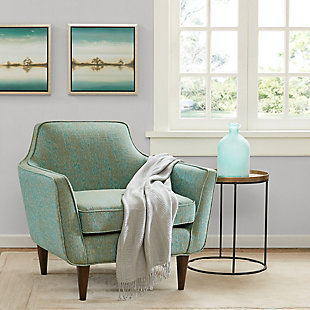 Grace your living room with the Cruz Accent Chair. The elegant mid-century modern curves of the chair are emphasized by the tonal, textural solid upholstery. And with high-density foam cushioning, this chair provides both comfort and a pop of cool with ease.Made with wood | Polyester/acrylic upholstery | High-density foam filling | Assembly required