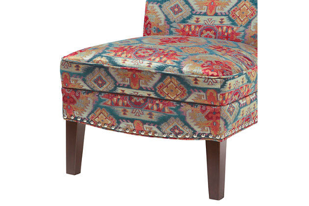 The Hayden Slipper Accent Chair is the perfect marriage of convenience and comfort. With its gracefully shaped back and armless styling, combined with a colorful tribal pattern, it will be a stunning accent piece in your room.Made with wood | Legs with espresso-hued finish | Polyester upholstery | High-density foam filling | Silvertone nailhead trim | Tight back, attached seat | Assembly required