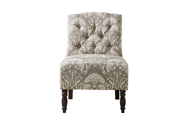 The Lola Tufted Armless Chair has a delightfully cozy vintage appeal. Classic button tufting, an armless design and turned legs marry to create this timelessly chic look.Made with wood | Legs with espresso-hued finish | Polyester upholstery | High-density foam filling | Hand-carved spooled legs | Button tufting | Assembly required