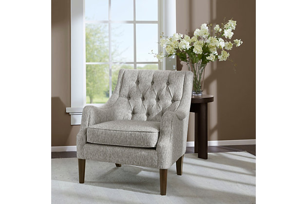 The vintage-inspired Qwen Accent Chair is the epitome of beauty and grace. It showcases sweeping serpentine arms and a soft, diamond-tufted back resting elegantly on tapered posts. With this chair, it's easy to curate a cozy antique retreat.Made with wood | Legs with Morocco finish | Polyester upholstery | Foam filling | Loose seat cushion | Button tufting | Assembly required