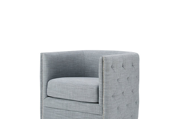 Update your living room with the rich style of the Madison Park Capstone Swivel Chair. The curved back and arms frame the wide seat, while silvertone nailhead trim adds a classic touch. Slate upholstery looks cool and cozy, while the swivel feature allows the lounge chair to rotate on its base for ultimate versatility.Made with wood | Metal base with black finish | Polyester/linen upholstery | High-density foam filling | Silvertone nailhead trim | Swivel feature