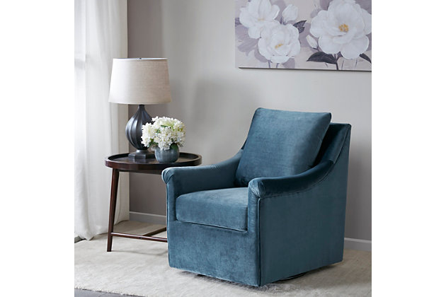 The curved arms and straight back of the Madison Park Deanna Swivel Chair adds a touch of glamour to any space. A swivel feature allows it to smoothly rotate on its base. Upholstered in blue velvet fabric, this lounge chair will be an eye-catching addition to your home.Made with wood | Metal base with black finish | Polyester upholstery | High-density foam filling | Swivel feature