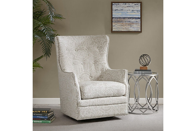 The Madison Park Ella Swivel Glider Chair elegantly combines style and comfort for the perfect addition to your living space. This oversized wingback-style chair features a tonal pattern in a rich cream hue for a refined transitional look. Button detailing on the high back and pewter-tone nailheads highlight the design. A swivel base allows the chair to rotate 360 degrees for superior comfort.Made with wood | Metal base with black finish | Polyester/linen upholstery | Cushion with foam filling; back with foam and polyfiber batting | Pewter-tone nailhead trim | 360-degree swivel