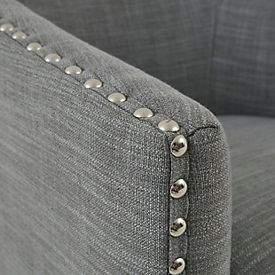 Relax in style with the Madison Park Tyler Swivel Chair. Its curved design and high-density foam cushion create a deep and comfortable seat, allowing for instant relaxation. Silvertone nailheads lining the arms and back add charm and style, while the swivel feature allows for easy mobility. Upholstered in a rich gray fabric, this swivel chair fits in any room of your home.Made with wood | Metal base with black finish | Polyester/linen upholstery | High-density foam filling | Silvertone nailhead trim | 360-degree swivel