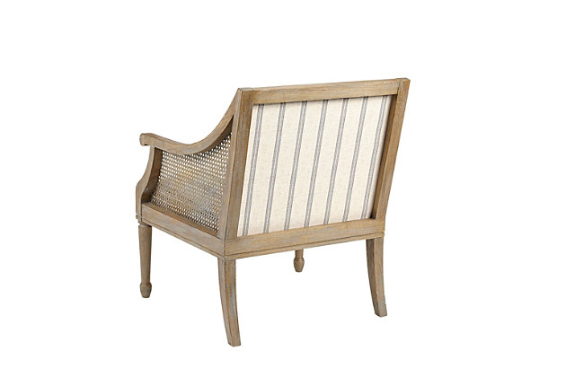 Complete your living room decor with the unique and charming Isla Accent Chair. Embodying country farmhouse living, it features an upholstered seat and backrest with synthetic cane inset arms. The frame and legs showcase a reclaimed natural finish to complement the upholstery. Made with wood | Legs with reclaimed natural finish | Synthetic cane webbing arms | Polyester upholstery | Foam filling | Assembly required