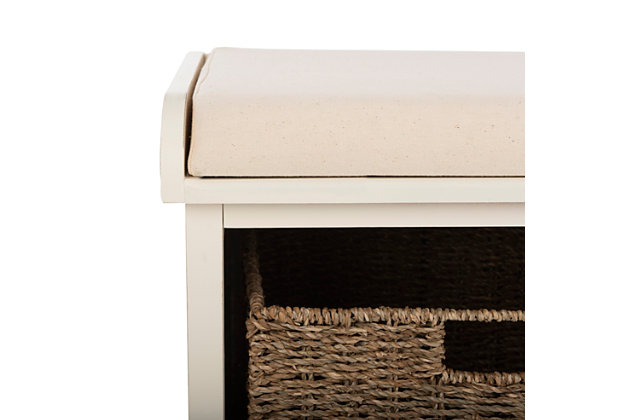 The Lonan storage bench is the perfect perch for removing boots or garden shoes in an entry hall.  Crafted of pine in a handsome white finish, this useful piece has three removable storage bins of woven rattan and a flip-top seat covered in white cotton.Made of pine wood; cotton wrapped foam cushion | White finish | Flip-top seat with white upholstery | 3 woven rattan storage bins | Assembly required