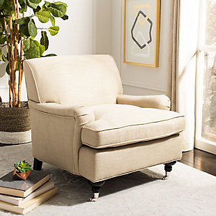 Sit back and relax in the sophisticated yet inviting Chloe club chair.  With curvy turned birch wood legs on casters in a striking espresso finish, this transitional design features low arms and a T-shaped bottom cushion with plush padding. Antiqued gold upholstery fabric and black flat nailhead trim add an easy-going appeal.Made of birch wood, stainless steel, viscose/linen/cotton fabric and soft polyfill | Antiqued gold upholstery | Turned legs in espresso finish | Black flat nailhead trim | Assembly required