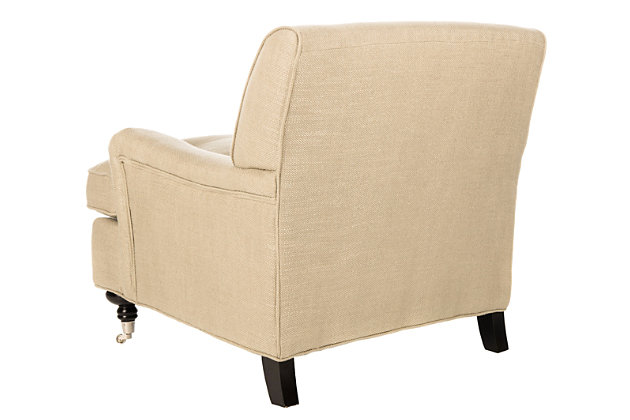 Sit back and relax in the sophisticated yet inviting Chloe club chair.  With curvy turned birch wood legs on casters in a striking espresso finish, this transitional design features low arms and a T-shaped bottom cushion with plush padding. Antiqued gold upholstery fabric and black flat nailhead trim add an easy-going appeal.Made of birch wood, stainless steel, viscose/linen/cotton fabric and soft polyfill | Antiqued gold upholstery | Turned legs in espresso finish | Black flat nailhead trim | Assembly required