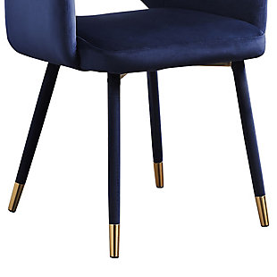 Comfort and elegance are combined in this contemporary style accent chair with smooth velvet fabric upholstery. It features an open design curved back with sloped armrests and padded seat. Aesthetically pleasing and practical, velvet wrapped angled legs are accented with metal caps in a goldtone finish.Velvet wrapped wood legs with goldtone metal tips and velvet fabric upholstery | Curved back with open design | Sloped padded armrests | Imported | Assembly required
