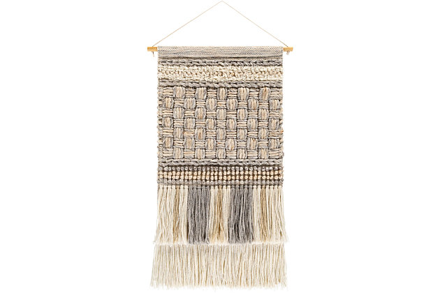 Drawing from bohemian and global inspired styles and designs, this wall hanging is sure to be a trendy addition to your decor space. The handwoven construction of this piece offers natural textures and intricate qualities making retro-chic art that caters towards an unconventional way to decorate your living space by adding eclectic charm to any room.Made of wool, polyester, cotton and wood | Handwoven | Khaki, light gray, medium gray, ivory and dark brown | Fringe | Cord for hanging | Indoor use only | Spot clean with a soft, dry cloth