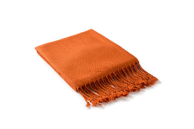 Wrap yourself in color and comfort with this tantalizing throw in burnt orange. Subtle herringbone weave adds a touch of classic texture.Made of acrylic | Imported | Spot clean only