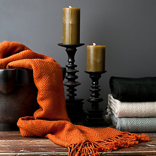 Wrap yourself in color and comfort with this tantalizing throw in burnt orange. Subtle herringbone weave adds a touch of classic texture.Made of acrylic | Imported | Spot clean only