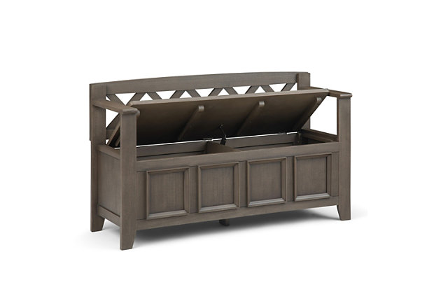 The Amherst storage bench, made from solid wood, allows your inner designer to shine through while creating added storage and seating for your entryway or mudroom. "Form follows function" design rules apply here as the bench features a convenient flip up lid allowing for easy retrieval of articles from the dual storage compartment below.Made of solid wood | Farmhouse gray finish and a protective NC lacquer | Lift up bench lid opens using safety hinges to expose 2 large internal storage compartments | Library framed square front panels; X-back and side design | Seats 2 comfortably | Assembly required | 1-year warranty
