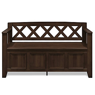 The Amherst storage bench, made from solid wood, allows your inner designer to shine through while creating added storage and seating for your entryway or mudroom. "Form follows function" design rules apply here as the bench features a convenient flip up lid allowing for easy retrieval of articles from the dual storage compartment below.Made of solid wood | Natural aged brown with a protective NC lacquer to accentuate and highlight the wood grain | Lift up bench lid opens using safety hinges to expose 2 large internal storage compartments | Library framed square front panels; X-back and side design | Seats 2 comfortably | Assembly required | 1-year warranty