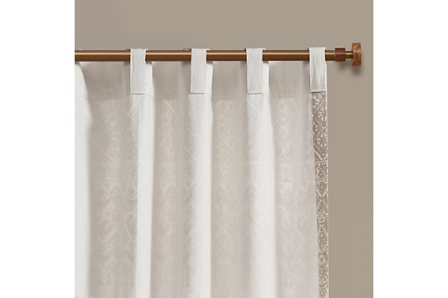 The INK+IVY Mila Cotton Printed Window Panel with Chenille Detail and Lining gives your home decor a chic boho touch. This natural white cotton window panel features an intricate navy global inspired print combined with rich tufted chenille detailing, for a textured artisanal look and feel. A lightweight white cotton lining on the reverse softly filters light, while providing better drapability and added privacy. In addtition, this 100% cotton curtain panel is also OEKO-TEX certified, meaning it does not contain any harmful substances or chemicals for the best in quality comfort and wellness. Each panel is finished with a rod pocket top for easy hanging, and back tabs for a more clean and tailored finish. This window panel is sold as a single and 2 window panels must be purchased to cover any standard size window. Complete the look with coordinating bedding sets, available and sold separately.Imported | 100% cotton printed with chenille tufted detail window curtain panel | Textured artisanal look and feel | Rod pocket and back tab finish | Fits up to 1.25 inches rod in diameter | Added cotton lining for light filtering and more privacy | Oeko-tex certified, includes no harmful substances or chemicals (#19.hin.92128) | Coordinate matching bedding and bath available and sold separately | Need to purchase two panels for each window | Machine wash for easy care
