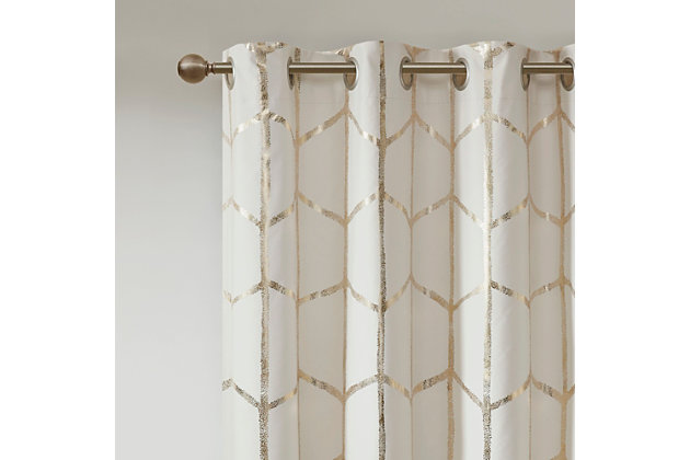 Freshen up your space with the enchanting style of Intelligent Design Raina Window Panel. The stunning panel flaunts a geometric, metallic gold print against a soft ivory ground for a fun and eye-catching look! Finished with a heavy 3 pass foamback liner, this panel is 100% total blackout providing energy efficiency and added privacy. Grommet top makes this panel easy to hang, open, and close through the day. Machine washable for easy care; complete the collection with coordinating bedding and shower curtain sold separately.Imported | Stylish and practical total blackout curtain panel in metallic print | Energy efficient, block noise intrusion and maximum privacy | Feature 3 pass foamback blackout liner to block sunlight and all lights | Silver grommet top that fits up to 1.25 inches rod in diameter | Need to purchase 2 curtain panels for each window | Machine washable for easy care