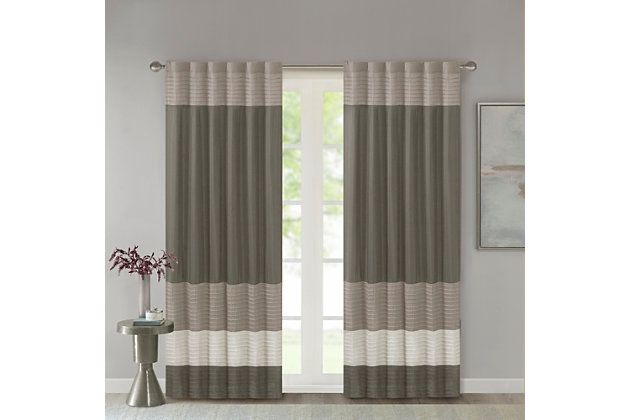Madison Park Amherst Polyoni Pintuck Window Curtain is a simple way to add style to your room. This window panel features a modern striped design in natural hues of ivory, taupe, and mocha combined with pintuck detailing for beautiful texture and dimension. The added lining helps filter the perfect amount of light and creates fullness for better drapability. Simply hang using rod pocket or with back tabs for a tailored look. This window curtain fits up to a 1.25" diameter rod.Imported | Transitional pintucking window panel | Back tab or rod pocket to hang | Pieced in colorblock polyoni with pintucking | Lined for more privacy | Light sheen fabric | As shown in image - need to purchase 2 curtain panels for each window for standard coverage | Machine washable