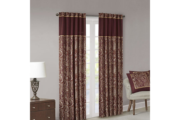 For a luxuriously classic style, our Madison Park Aubrey Window Curtain Pair is the perfect touch to your decor. The alluring jacquard weave is inspired from an updated paisley motif and is woven in beautiful hues of burnt red, gold, and a hint of platinum for a shimmering accent. The window panels are pieced with solid faux silk and beautiful flat piping details in gold, creating an elegant look. Simply hang on rod pocket or back tabs for a tailored finish; fits up to a 1.25 diameter rod.Imported | 100% polyester panel pair | Faux silk light sheen base fabric for light filtering | Paisley jacquard weave design curtains | Rod pocket and back tabs top finish with pieced and piping details | Machine wash for easy care