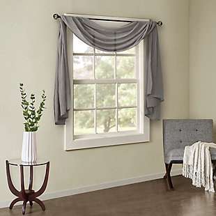 Soften the edges of your window, with our Madison Park Harper Solid Crushed Sheer Scarf. This light grey scarf features crushed detailing for beautiful texture, while the lightweight sheer fabric provides easy draping and an airy touch to your decor. Four tabs are also included to make the DIY assembly easy so you can drape the scarf to best fit your window. For a complete look, layer this scarf with coordinating panels or prints in our collection for a more custom appeal.Imported | Comes with 4 tabs for easy assembly | Coordinate with window panel for complete look | Diy and drape to best fit your window | Lightweight sheer crushed fabric for texture | Layer for custom look