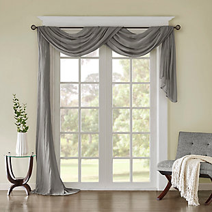 Soften the edges of your window, with our Madison Park Harper Solid Crushed Sheer Scarf. This light grey scarf features crushed detailing for beautiful texture, while the lightweight sheer fabric provides easy draping and an airy touch to your decor. Four tabs are also included to make the DIY assembly easy so you can drape the scarf to best fit your window. For a complete look, layer this scarf with coordinating panels or prints in our collection for a more custom appeal.Imported | Comes with 4 tabs for easy assembly | Coordinate with window panel for complete look | Diy and drape to best fit your window | Lightweight sheer crushed fabric for texture | Layer for custom look