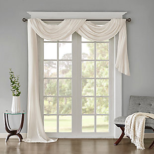 Soften the edges of your window, with our Madison Park Harper Solid Crushed Sheer Scarf. This crisp white scarf features crushed detailing for beautiful texture, while the lightweight sheer fabric provides easy draping and an airy touch to your decor. Four tabs are also included to make the DIY assembly easy so you can drape the scarf to best fit your window. For a complete look, layer this scarf with coordinating panels or prints in our collection for a more custom appeal.Imported | Comes with 4 tabs for easy assembly | Coordinate with window panel for complete look | Diy and drape to best fit your window | Lightweight sheer crushed fabric for texture | Layer for custom look