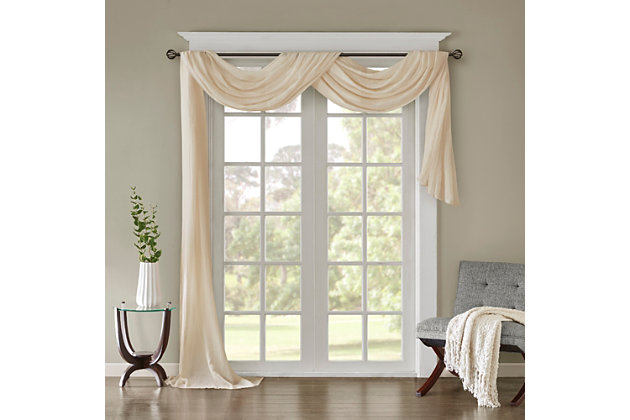 Soften the edges of your window, with our Madison Park Harper Solid Crushed Sheer Scarf. This rich cream scarf features crushed detailing for beautiful texture, while the lightweight sheer fabric provides easy draping and an airy touch to your decor. Four tabs are also included to make the DIY assembly easy so you can drape the scarf to best fit your window. For a complete look, layer this scarf with coordinating panels or prints in our collection for a more custom appeal.Imported | Comes with 4 tabs for easy assembly | Coordinate with window panel for complete look | Diy and drape to best fit your window | Lightweight sheer crushed fabric for texture | Layer for custom look
