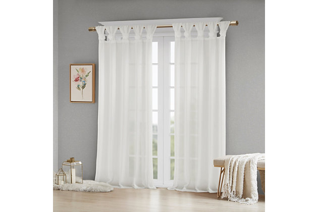 Simple and feminine in all the right ways, Madison Park Rosette Tab Top Solid Window Panel Embellished with Flower offers a gorgeous one-of-a-kind look to your home. This solid white panel features a tab top finish and beautiful removable floral pins that give your room a decorator’s touch. The lightweight faux linen semi-sheer fabric filters the perfect amount of light into your home,  while creating a soft airy feel - for the perfect shabby chic update to your decor. Window panel is machine washable for easy care, while floral pins are spot clean only. Fits up to a 2" diameter rod.Imported | Tab top curtains that can fit up to 2"" diameter rod | Removable floral pins for decorators touch | Lightweight faux linen sheer base for natural look and feel | Shabby chic home decor | Available in 63, 84 or 95 inches in length curtain panel | Need to buy 2 panels for each window | Machine washable for easy care - remove all flowers before machine washing