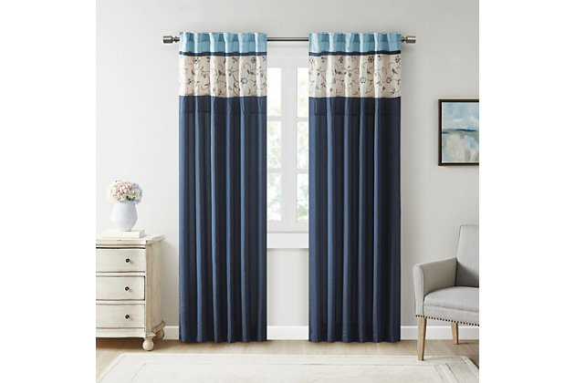 The Serene window panel adds a simple elegant touch to any room. The deep navy color combined with soft ivory and chocolate brown creates the perfect classic look. The panel features delicate floral embroidery and pleated details that add dimension. Added lining helps to filter light and provide some room darkening features. Panel is made with 3" rod pocket as well as back tabs; fits up to 1.25" diameter rod.Imported | Embroidery | Pieced and pleated detailing | Added lining | Rod pocket and back tabs